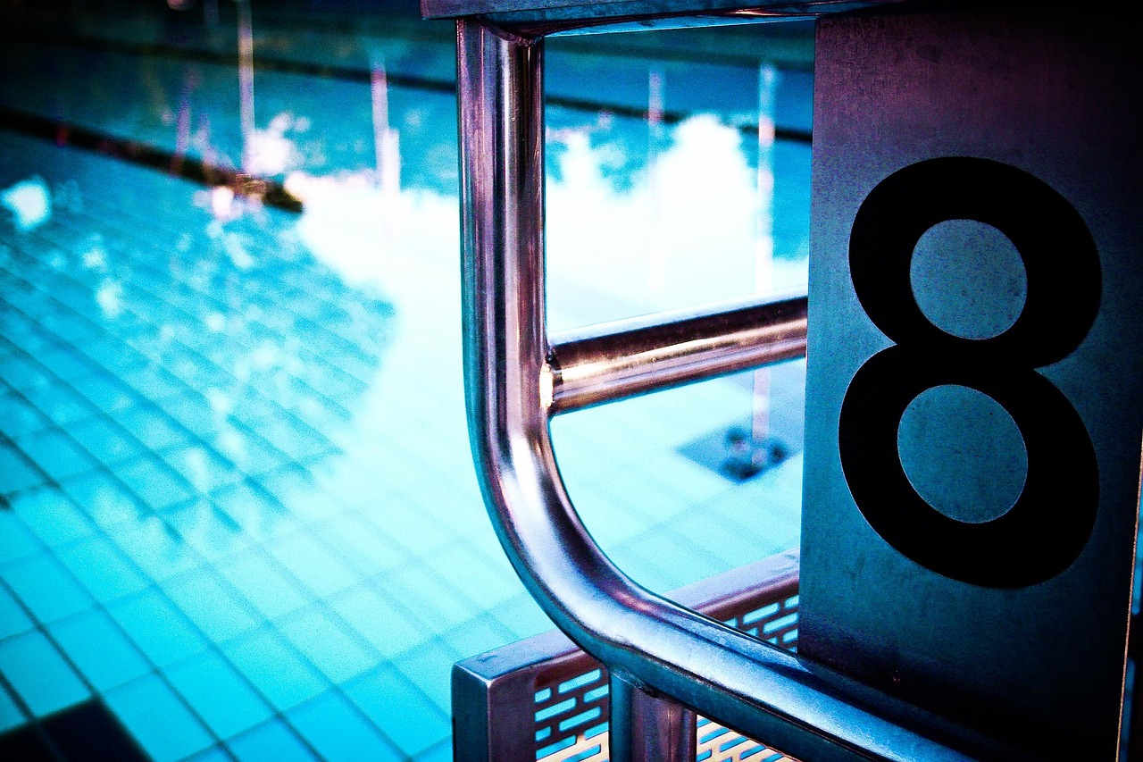 Older backyard pool in Gilbert being assessed for a remodel